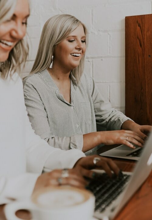 two employees working at a desk